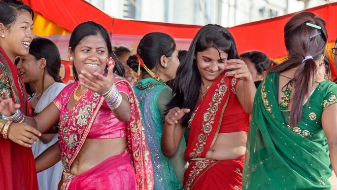Women dancing in a Shiva temple premises on the day of Teej. 