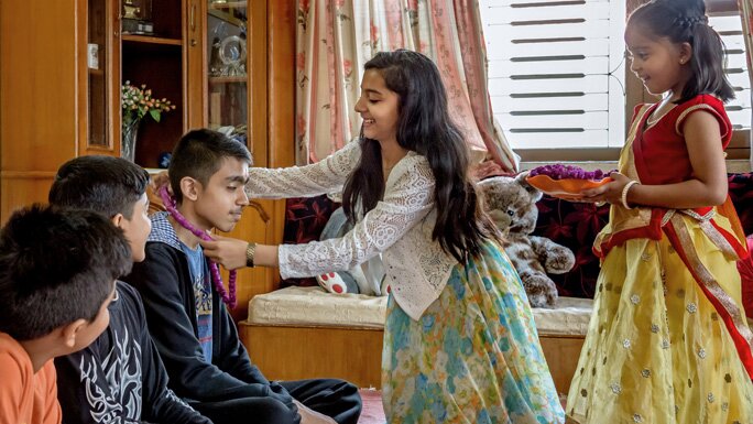 Sister offer puja and gifts to brothers during Bhai Tika in Tihar. 