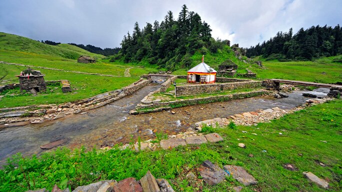 Tribeni ghat, at the confluence of rivers and green hills of Khaptad National Park