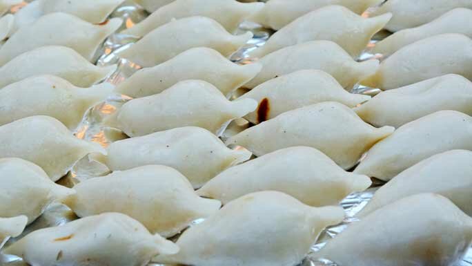 Fresh Yomari, a rice sweetmeat, filled with molasses and sesame seed, enjoyed by Newars of Kathmandu valley during Yomari Punhi, a harvest festival. 